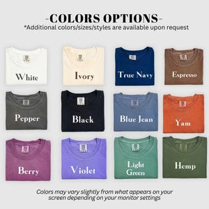 May include: A grid of twelve t-shirts in various colors labeled White, Ivory, True Navy, Espresso, Pepper, Black, Blue Jean, Yam, Berry, Violet, Light Green, and Hemp. Each shirt features a visible neck label with text and a brand logo.