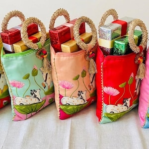 Assorted and Colorful Lotus and Cow Pichwai Print Silk Potli Bags|Return Gifts|Wedding Favors | Housewarming| Party favor return gifts potli