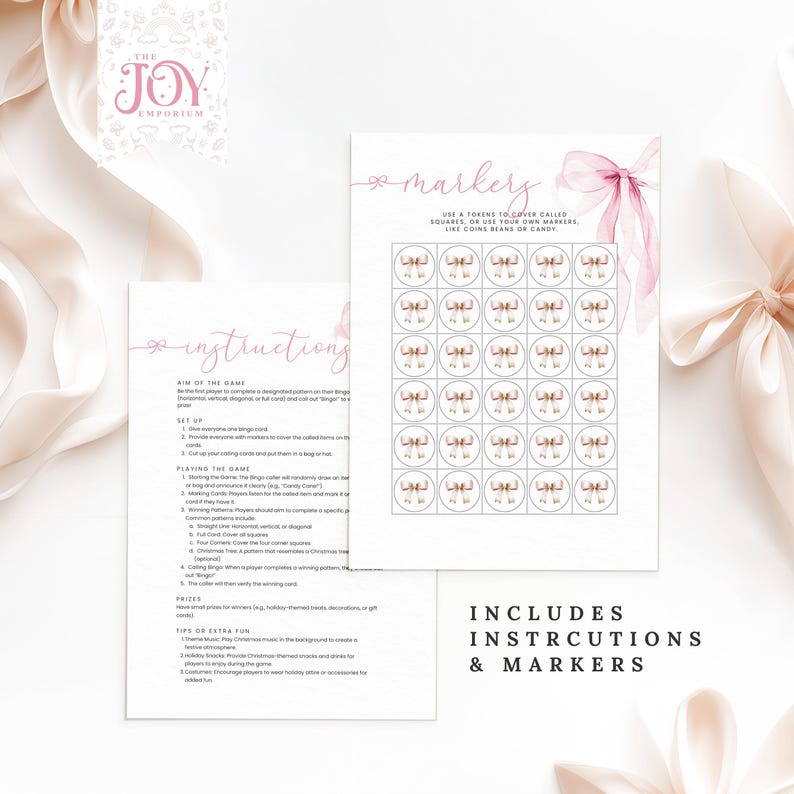 May include: A printable bingo game with instructions and markers. The game features a pink and white design with a bow and the text "The Joy Emporium".