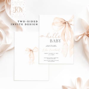 May include: Two-sided baby shower invitation with a watercolor illustration of a pink ribbon bow. The text on the invitation reads "hello baby" and includes the date, time, and location of the shower.