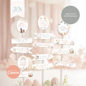 May include: Printable Easter egg hunt signs with a watercolor floral design. The signs feature phrases like "You're Really Close", "Bunny Trail", "This Way", and "Wrong Way".