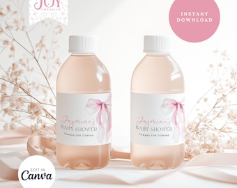 May include: Two clear plastic water bottles with pink and white labels. The labels feature a watercolor illustration of a pink ribbon and the text "Jasmine's Baby Shower Thanks for Coming".
