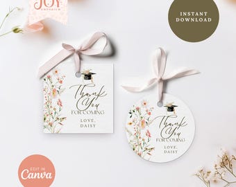 May include: Two white graduation thank you tags with floral accents and a graduation cap illustration. The tags have the text "Thank You For Coming, Love, Daisy" and are tied with a light pink ribbon.