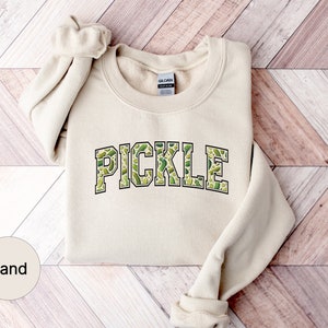 a sweater with the word pickle printed on it