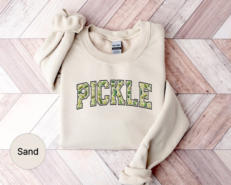 a sweater with the word pickle printed on it