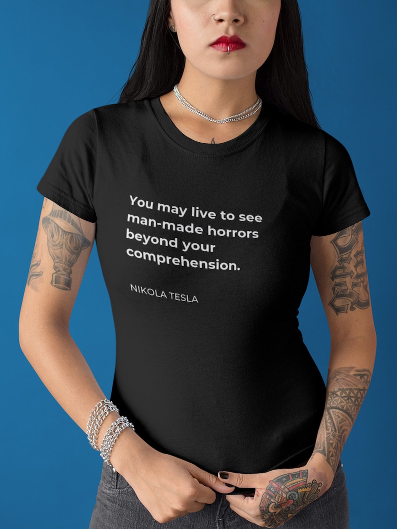 May include: Black t-shirt with a white quote by Nikola Tesla: "You may live to see man-made horrors beyond your comprehension."
