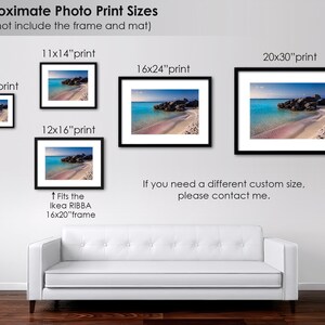 May include: A white sofa sits in front of a wall with a variety of framed photos of a beach scene. The photos are labelled with their approximate print sizes in inches, including 8x10, 11x14, 12x16, 16x24, and 20x30. The text "Approximate Photo Print Sizes" is at the top of the image, and the text "(does not include the frame and mat)" is below it. The text "If you need a different custom size, please contact me." is below the photos.