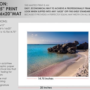 May include: A framed photograph of a beach scene with turquoise water, a rocky outcropping, and a sandy shore. The image is matted with a white mat and measures 16 inches by 20 inches. The opening for the print is 10.75 inches by 14.75 inches.