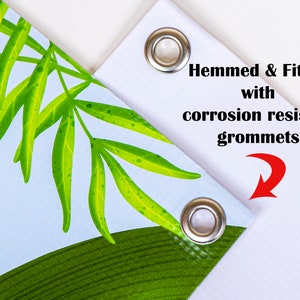 Shown are two vinyl banner corners finished with silver metal corrosion resistant grommets applied to hemmed edges.
