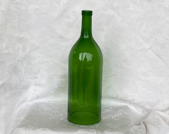 A wine bottle with bottom removed for crafting wind chimes or candle cover