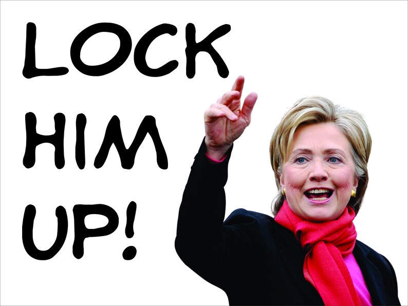 May include: A woman wearing a black jacket and a red scarf raises her right hand in the air. The text "LOCK HIM UP!" is written in black on a white background.