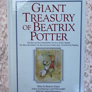 May include: A blue book with the title "Giant Treasury of Beatrix Potter" in red lettering. The book features an illustration of a fox and a duck on the cover.