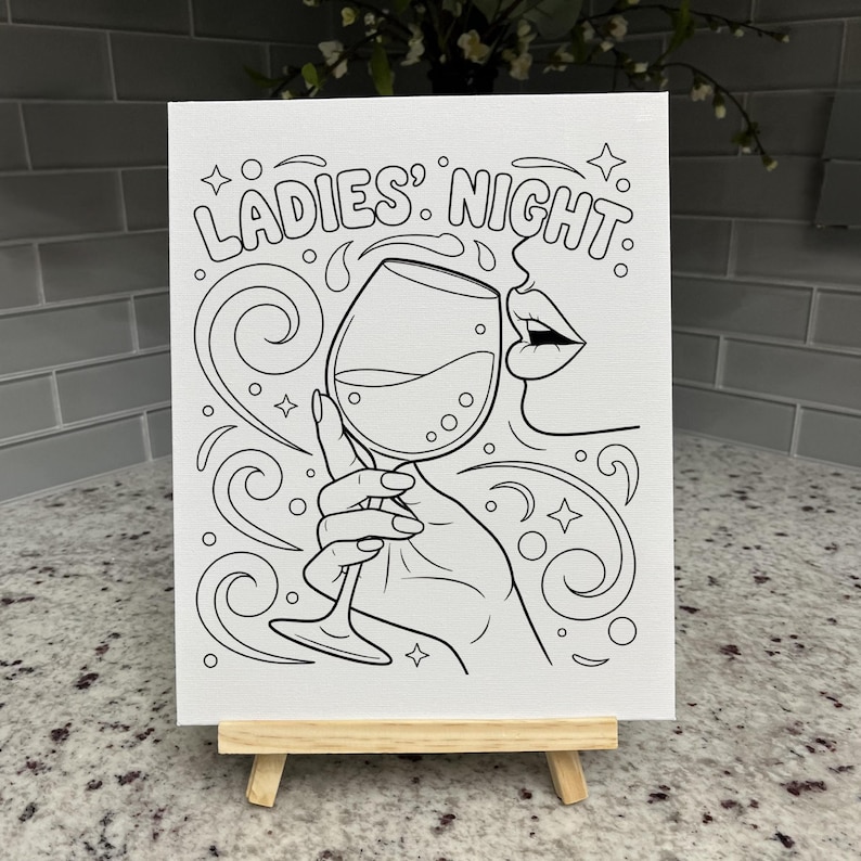 May include: A white canvas featuring a black line art illustration of a hand holding a wine glass, with the text LADIES' NIGHT above. The design includes swirling decorative lines, small stars, and a partial profile of a face with lips.