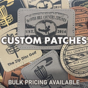 May include: A collection of custom leather patches featuring various designs, including a disc golf course, a zipline, a beer garden, and a keg. The patches are brown and beige with black stitching and text. The text on the patches includes "Helotes Hill Country Ziplines", "The Zip Disc Golf", "Hill Country Keg", and "Custom Patches".