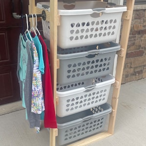 Laundry basket tower with clothes hanger