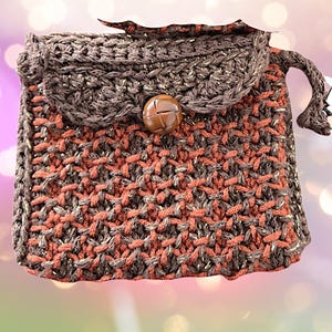 Monedero/billetera elegante. Un dije/llavero para bolso. Un accesorio versátil para tu bolso. Lleva cómodamente auriculares, teléfonos plegables o monedas.