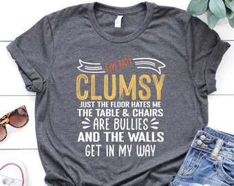 Funny Clumsy Shirt: "The Floor Hates Me" Graphic Tee