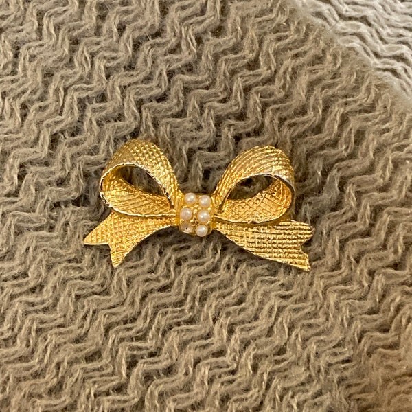 Vintage Gold-Toned Textured Bow Pin with a Touch of Class, faux pearls in the center. Pre loved.