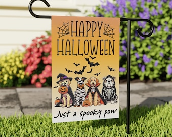 May include: A Halloween garden flag with the words "HAPPY HALLOWEEN" and "Just a spooky paw". The flag features illustrations of dogs dressed in Halloween costumes, including a witch, mummy, vampire, and skeleton. The background is orange and yellow.