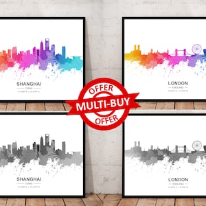 May include: Four watercolor city skyline prints, two in color and two in black and white. The prints feature the skylines of Shanghai, China and London, England. Each print includes the city name, country, and coordinates.