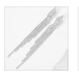May include: Three pairs of silver dangle earrings with crystal accents. The earrings are all different styles, with one pair featuring a teardrop shape, one pair featuring a long, cascading design, and one pair featuring a twisted design.