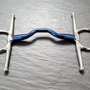 May include: A blue and silver horse bit with a curved mouthpiece. The bit has two rings on either side and a centre bar.