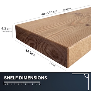 May include: A wooden shelf with dimensions displayed. The shelf is light brown, with a thickness of 4.3 cm (1.7 inches), a depth of 14.5 cm (5.7 inches), and a length ranging from 40 to 140 cm (15.7 to 55.1 inches). The text "SHELF DIMENSIONS" is at the bottom.