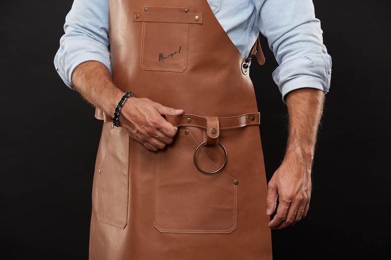 May include: A handmade, wooden cutting board with a natural finish. The board features a juice groove and a handle for easy carrying. Dimensions are approximately 16 inches long, 10 inches wide, and 0.75 inches thick.