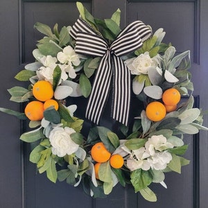 Farmhouse cottagecore citrus summer orange home decor front door wreath with oranges and white hydrangeas, great in kitchen