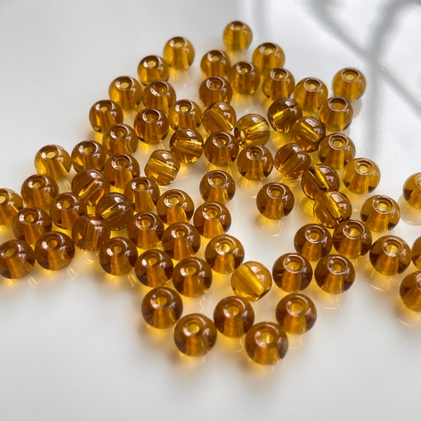 30 - 6mm Transparent Amber Round #1377