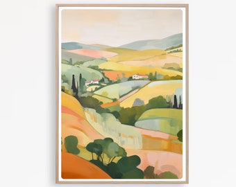 May include: A framed landscape art print depicting rolling hills in shades of yellow, orange, green, and blue. The artwork features stylized trees, houses, and a soft, pastel sky. The print is encased in a light-colored wooden frame.