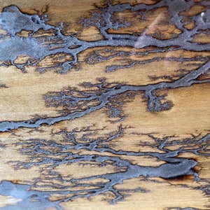 Poplar wood tray stained brown, with silver coloring and clear resin.  16.5&quot; x 7&quot; x 3.25&quot;