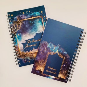 May include: Two spiral bound journals with a blue and gold galaxy design. The top journal has the text "A Reader Journal" and the bottom journal has the text "Wildflower Bookmarks".