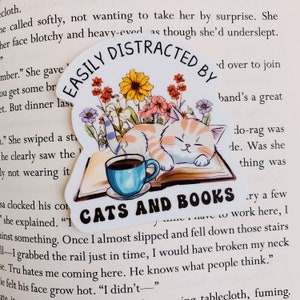 Easily distracted by books and cats sticker