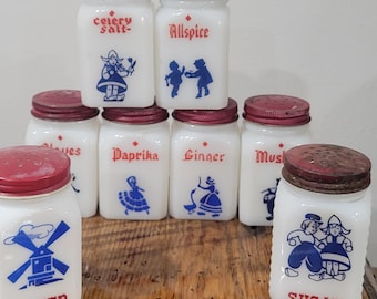 Vintage Hazel Atlas Salt and Pepper Shakers Dutch Boy and Girl are Red Metal Caps with Blue Painted Artwork Milk Glass Bottles