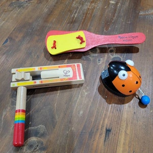 3er Set Holz-Musikinstrument für Kleinkinder. Rainbow Xylophone Hape Toys, Melissa & Doug Clapper,Castanet - Lady Bug,