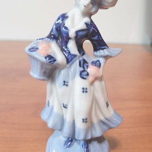 Vintage Porcelain Woman Blue and White Victorian Outfit with Pink Flower Accent Made in Occupied Japan