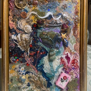 Mixed media collage coated with epoxy resin