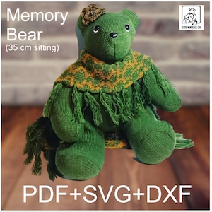 May include: Green memory bear with a yellow and green scarf, sitting on a wooden surface. The bear is 35 cm tall when sitting. The text "Memory Bear (35 cm sitting)" is at the top of the image. The text "PDF+SVG+DXF" is at the bottom of the image.
