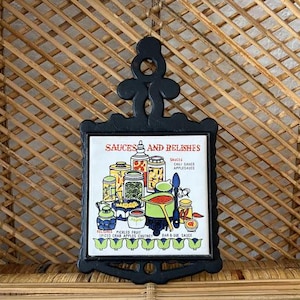 Vintage &#39;Sauces and Relishes&#39; Cast Iron and Cathay Tile Trivet Hot Plate