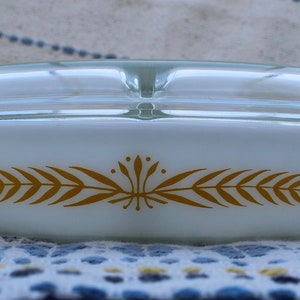 Pyrex, Royal Wheat (063), divided casserole dish with a lid.
