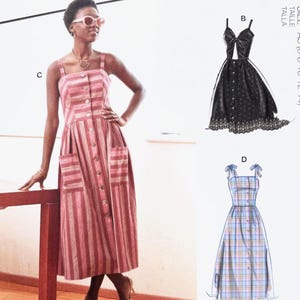 May include: A woman wearing a pink and white striped button-down dress with pockets. The dress is part of a McCall's sewing pattern, M7950, which includes designs for several dresses. The model is wearing pink sunglasses and a gold necklace.