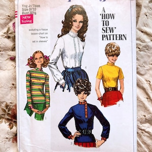 May include: A vintage Simplicity sewing pattern, number 7734. The pattern cover shows illustrations of four outfits, including a striped top, a blouse, and a blue jacket. The pattern is for young junior, teen, and misses sizes.