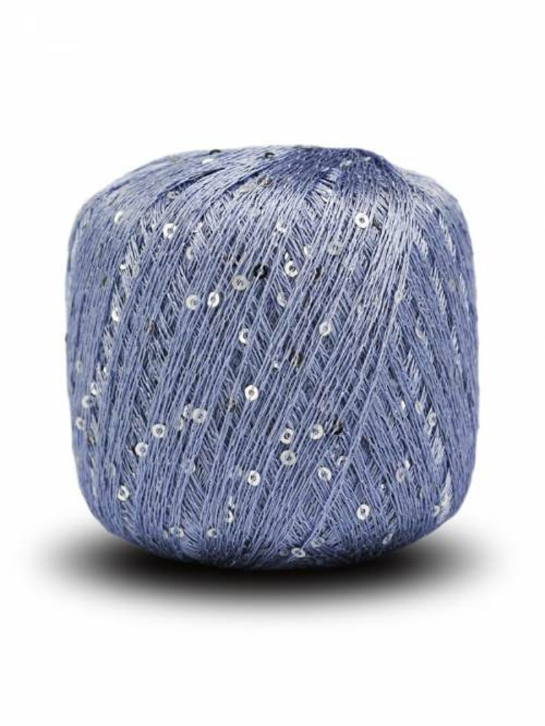 May include: A ball of light blue yarn with silver sequins woven throughout.