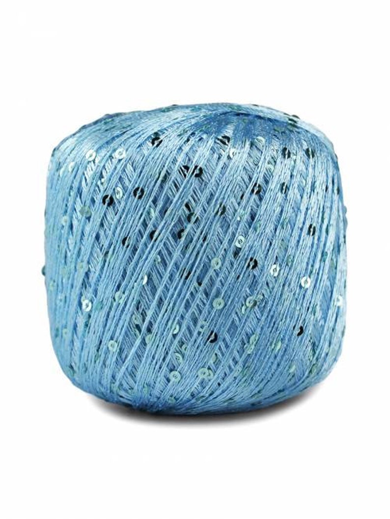 May include: A ball of light blue yarn with silver sequins woven throughout.