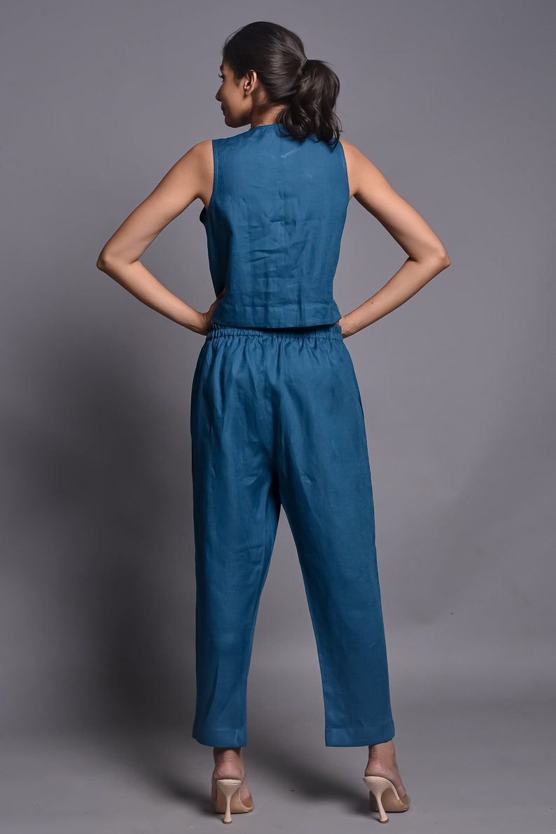 Top and pant
✽ Sleeveless top 
✽ Fabric button which are Functional
✽ Tapered pants with side pockets  
✽The soft Elastic waist band automatically adjust to a gentle hold without the hassle of zipper or bottom clause