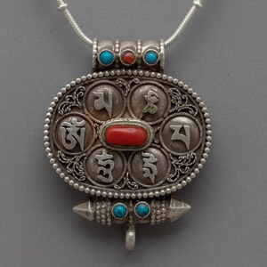 Oval Shaped Buddhist Locket with Mantra Engraving | Unique Mantra Engraved Locket | Handcrafted Locket with Ancient Buddhist Inscriptions |