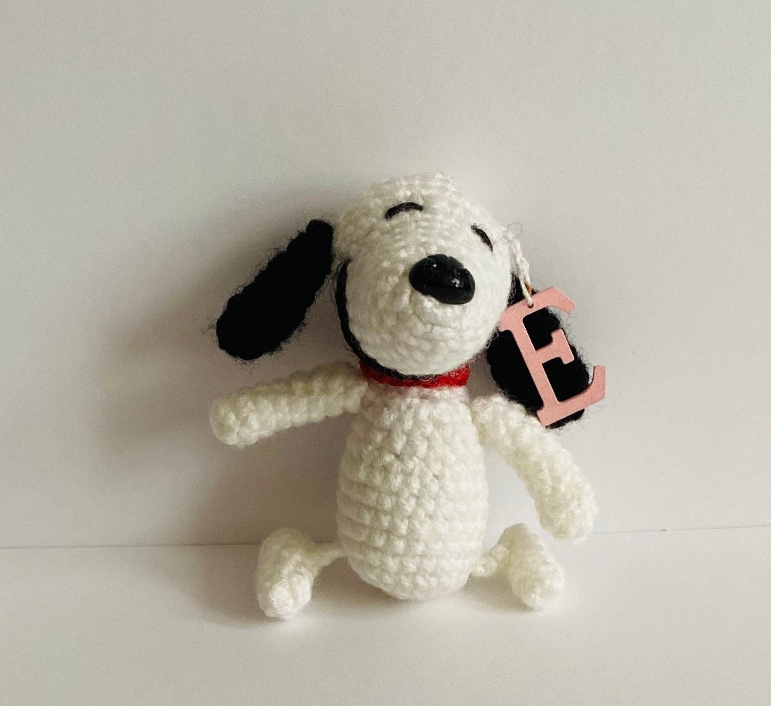 Snoopy in a puffer coat keychain