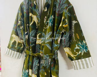 May include: A green robe with a white and green striped pattern on the sleeves and collar. The robe has a belt and features a jungle print with leopards, palm trees, and other tropical plants.