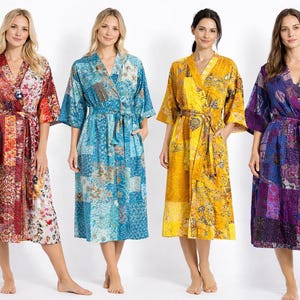 May include: Four colorful patchwork robes in red, blue, yellow, and purple. Each robe has a V-neck, short sleeves, and a matching belt. The robes are knee-length and have a relaxed fit, suitable for lounging or layering.
